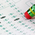 Pencil erasing an answer on a Scantron test form
